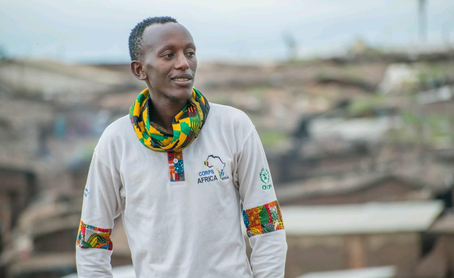 Héritier Kalala Leopold - at Dzaleka w OCP logo